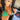 A pair of clear silver pave rhinestone floral dangle bikini jewelry earrings displayed by a bikini model.