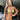A pair of gold chandelier bikini jewelry earrings embellished with multicolored AB rhinestones, displayed by a bikini and figure competition female bodybuilder.