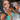 Pair of bikini competition earrings displayed by an npc bikini fit model.