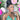 A pair of clear silver pave rhinestone floral dangle bikini jewelry earrings displayed by a bikini model.