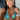 A clear silver pave rhinestone stretch bikini jewelry bracelet displayed by a npc bikini fit model division female bodybuilder.