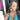 An NPC bikini and figure competition female bodybuilder wearing a pair of clear silver rhinestone drop bikini jewelry earrings.