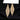 A pair of gold chandelier bikini jewelry earrings with clear rhinestones, displayed against a black background.