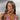 A pair of silver floral dangle bikini jewelry earrings adorned with AB rhinestones, displayed by an npc bikini fit model.
