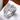 A silver clear pave rhinestone stretch bikini jewelry ring on a white textured surface.