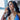 Clear rhinestone pave dangle bikini jewelry earrings displayed by an npc bikini fit model.