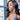 Clear rhinestone pave dangle bikini jewelry earrings displayed by an npc bikini fit model.