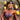 A pair of long, chandelier-style bikini jewelry earrings with clear crystal rhinestones mounted on a silver-colored frame, displayed by an npc bikini fit model.