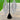 Video showing a pair of diamond bikini competition earrings on a black stand with a green grass gradient background.