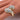 A gold-colored stretchable bikini jewelry ring with ab rhinestone pave embellishments.