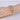 A gold-plated stretch rhinestone bikini jewelry bracelet with clear stones, displayed on a mannequin hand.
