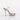 Beige high-heeled shoe with clear bikini heels platform and strap on a white background.