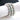 A silver-colored stretch bikini jewelry bracelet adorned with iridescent AB rhinestones, displayed on a marble surface.